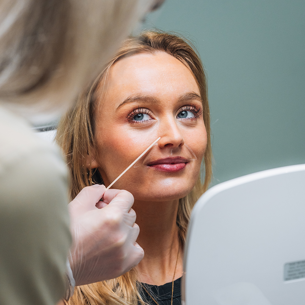 woman getting facial laser hair removal